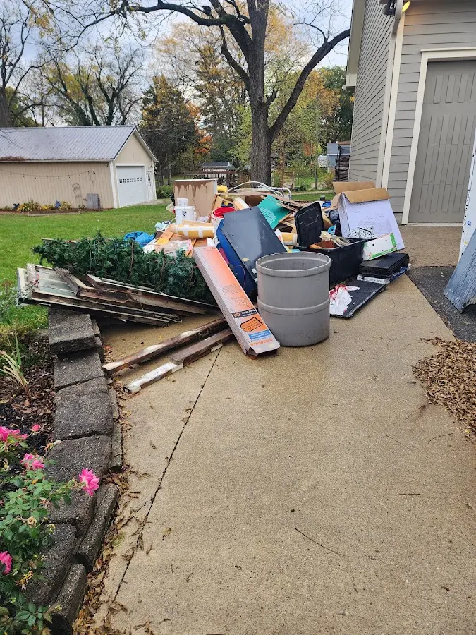 Dumpster being loaded with debris for 3 Yard Dumpster Rental in Allegany